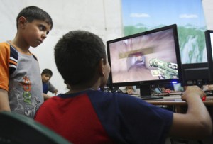Palestinian children playing computer games