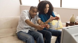 Man and woman playing video games together