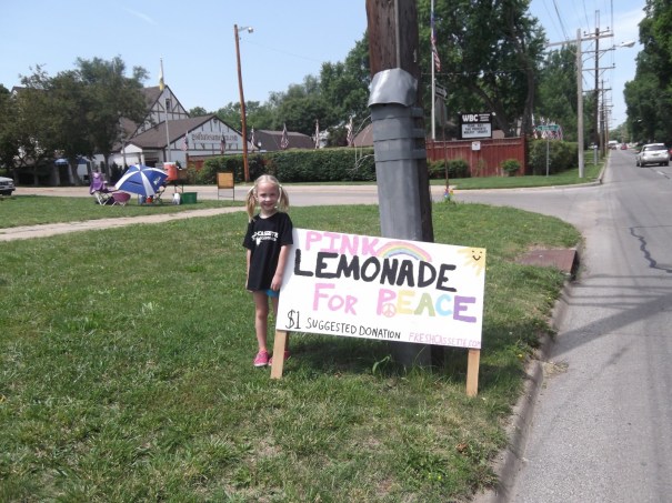 Jayden Sink with the Westboro Baptist Church in the background